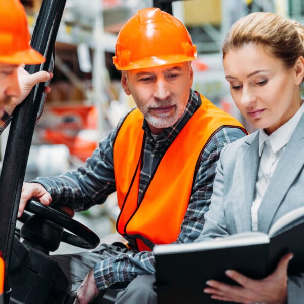 two workers inspector using forklift